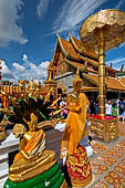 Chiang Mai - Wat Phra That Doi Suthep. The innercourtyard of the temple is filled with Buddha statues and other religious paraphenalia. 